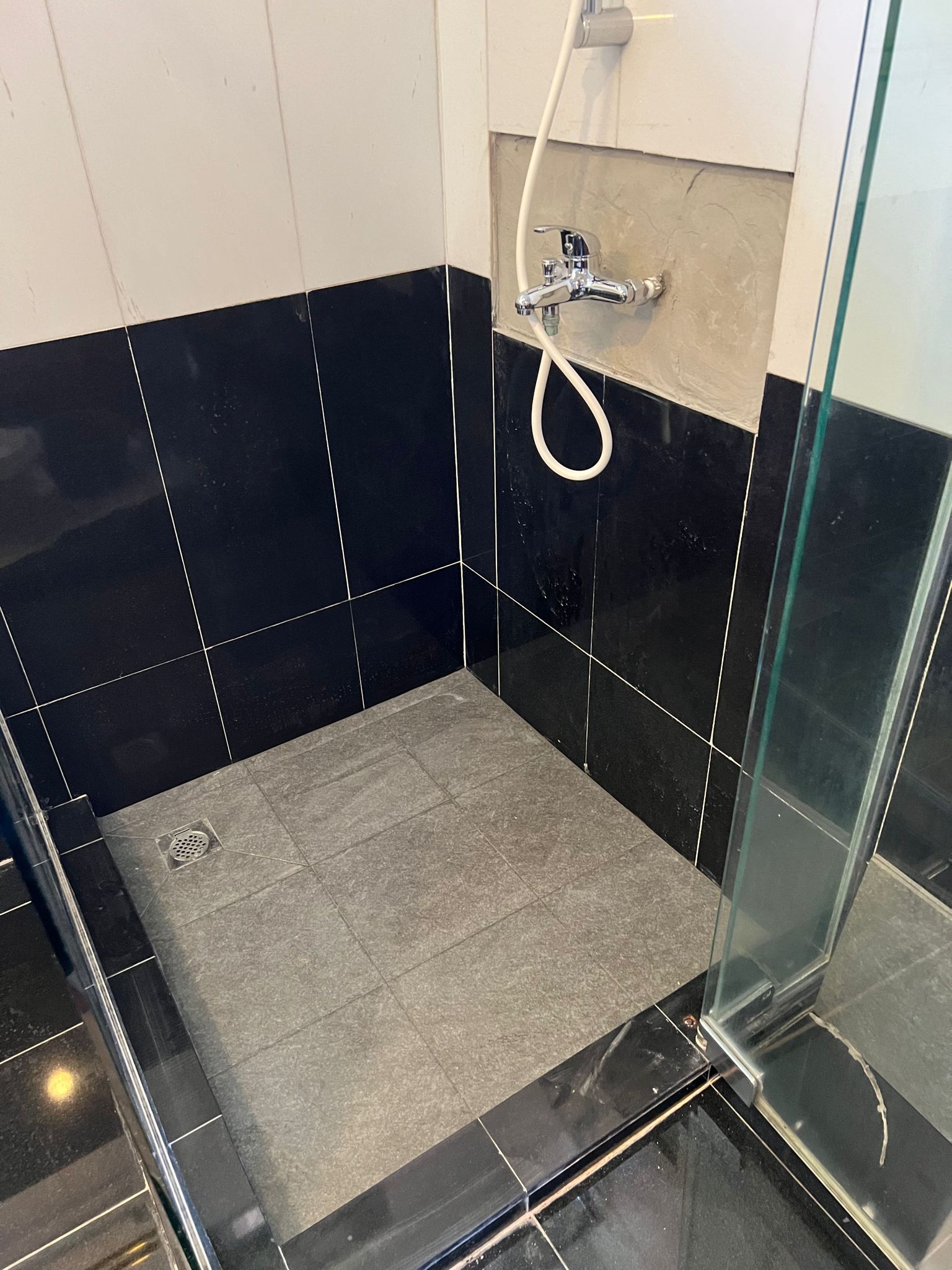 Replace mixer and overlay flooring tiles and 2 nos wall tiles